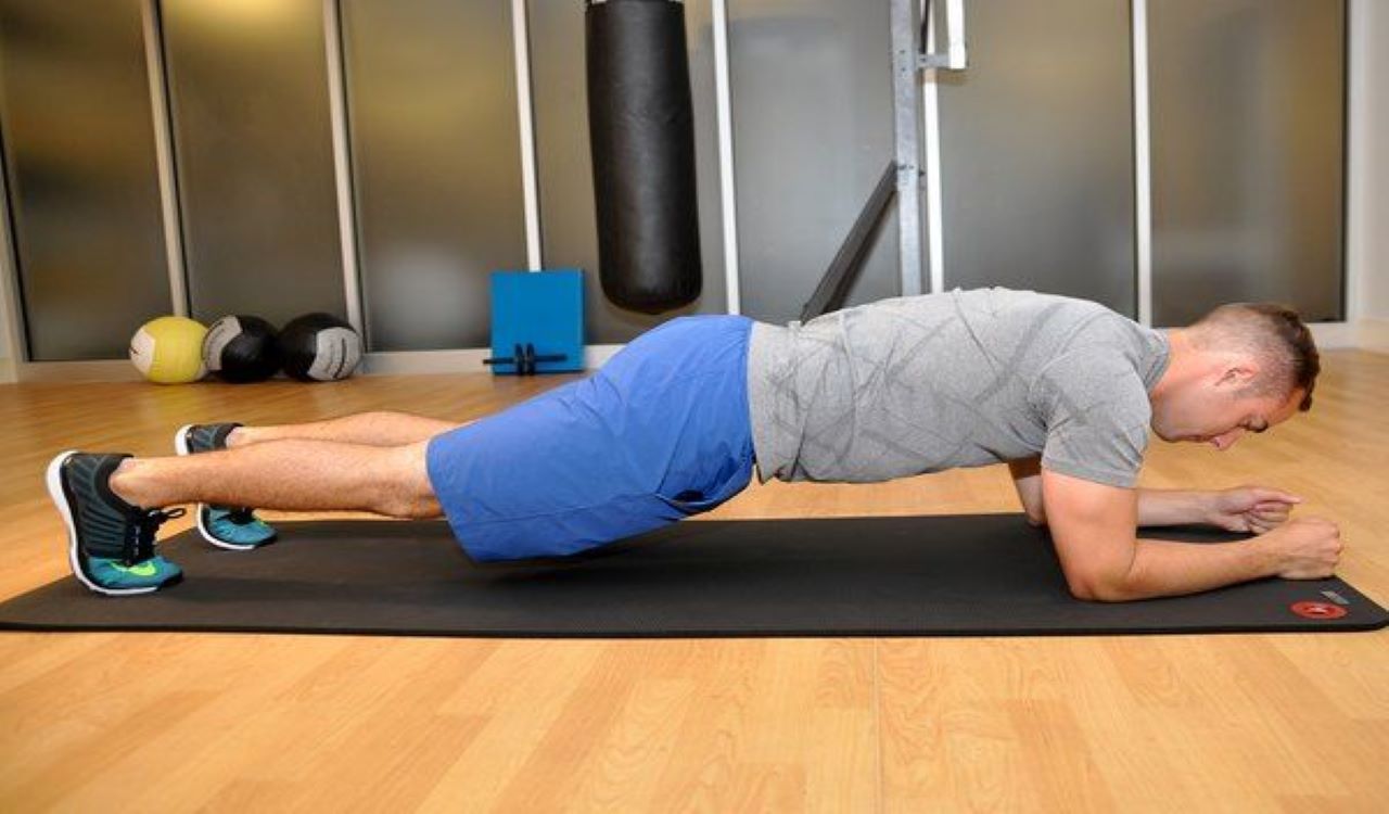 Man doing a forearm plank for an easy workout